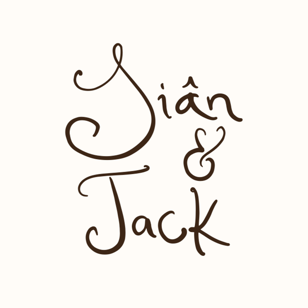 Engagement photo of the bride and groom by the ocean at sunset